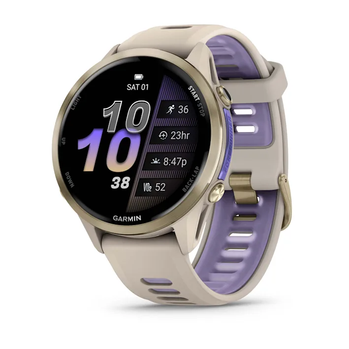 Garmin Forerunner 970 in French Gray with French Gray/Translucent Indigo silicone band, angled watch face