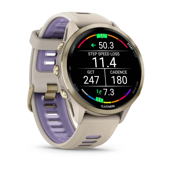 Garmin Forerunner 970 in French Gray with French Gray/Translucent Indigo silicone band, angled running-metrics display